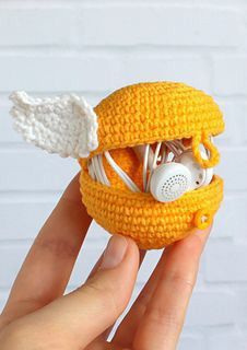 a crocheted toy with headphones in it