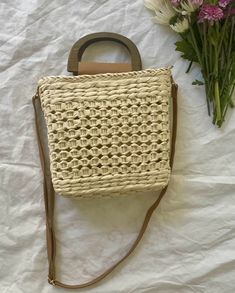 Our Ibiza straw crochet handbag is the perfect addition to your spring/summer wardrobe! This lightweight tote is a must for vacation! Lightweight Straw Woven Handbag Top handles and straps Materials: 100% Paper Straw Drawstring Opening-Polyester Lining Imported Approximately: 7x7.8 in Spring Woven Crochet Bag For Day Out, Woven Crochet Bag For Spring Day Out, Cream Bucket Bag With Adjustable Strap For Summer, White Beach Bag With Braided Handles For Day Out, Trendy Cream Crochet Bag For Summer, Trendy Summer Crochet Bag In Cream, White Crochet Rectangular Bag For Summer, White Crochet Bag With Handles For Summer, Beige Straw Crochet Bag For Day Out