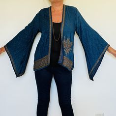 A Beautiful Boho Hippie Chic Kimono Jacket. Perfect for Holidays,Parties,Weddings and Celebrations as a Cover Up. Handmade in India from a Vintage Sari ,so completely unique and sustainable. The Fabric is a Gorgeous and Flattering Teal Silk Jacquard. The Exquisite Embellishment features a Paisley Design with 1000's of Glittering Sequins and Crystals. The Style is mid length ,with Kimono style sleeves. The size will fit and flatter sizes  S M L    UK 8 to 14 , US 4 to 10.   EU 36 to 42. The lengt Fall Festive Outerwear With Gold Embroidery, Festive Fall Outerwear With Gold Embroidery, Long Sleeve Party Outerwear With Intricate Embroidery, Festival Kimono With Long Sleeves, Bohemian Fitted Outerwear With Intricate Embroidery, Fitted Bohemian Outerwear With Intricate Embroidery, Long Sleeve Sequined Outerwear For Festivals, Bohemian Outerwear With Embroidered Kimono Sleeves, Bohemian Long Sleeve Kimono With Intricate Embroidery