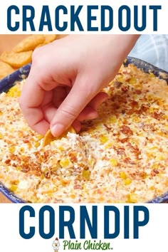 a hand dipping corn into a casserole dish with text overlay that reads cracker out corn dip