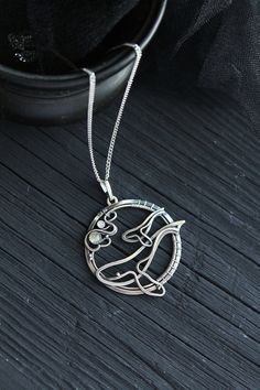 ITEM DESCRIPTION: The size of the pendant - H 4 х W 4 cm (1 1/2 x 1 1/2 inches), weight 7g. Jewelry will come to you in a gift box - ready for gifting. I made this motherhood jewelry of sterling silver, labradorite, and rainbow moonstone. This unique necklace looks so touching. This is a story of the relationship between parents and children. It is not easy. But this is important for each of us. I hope this wire wrapped necklace will be a wonderful gift for someone whole you love: for your mothe Spiritual Pendant Jewelry For Mother's Day, Spiritual Silver Jewelry Gift For Mom, Artistic Medallion Jewelry Gift, White Gold Jewelry With Large Pendant As Gift, Symbolic Jewelry With Large Pendant As Gift, Sterling Silver Large Pendant Jewelry For Wedding, Unique Jewelry For Mother's Day Gift, Symbolic Sterling Silver Jewelry Gift For Her, Silver Art Nouveau Necklace For Anniversary