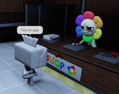 a cartoon character is sitting at a desk in front of a sign that says you're gay