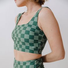 Our Olivia Top + Albion Check = Perfection! This top is ready for adventure with it's wide, supportive straps and built-in shelf bra. Not to mention this gorgeous emerald shade! Yes please! Removable bust cups Fully-lined Checker print 45 UPF Pair with Green Check High-Waisted Bottoms FREE U.S. Standard Shipping! More info hereModel Sophia is 5'6", a size 2, and wears an XS90% NYLON - 10% SPANDEXWash cold and lay flat to dry Albion Fit Swim, Albion Fit Swimsuit, Tomboy Look, Albion Fit, Maternity Swimsuit, Checker Print, Swimming Workout, Preppy Casual, Swim Skirt