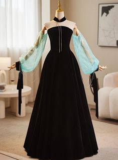 One dress that stands out with its impeccable blend of contemporary and classic design is this stunning black gown with sheer blue sleeves. The bodice is crafted to enhance your natural curves, offering a perfect balance of structure and elegance. The addition of the ethereal blue sleeves, decorated with delicate sparkles, adds a whimsical touch that is sure to captivate. The flowing black skirt brings a sense of drama and sophistication, making this dress an excellent choice for those looking to make a memorable statement. Designed with comfort and style in mind, this dress ensures you not only look incredible but feel confident and poised throughout the night. Sequins Prom Dress, Crystal Prom Dress, Ethereal Blue, Dinner Gown, Ethereal Dress, Velvet Prom Dress, Strapless Prom Dress, Prom Dress Plus Size, Sequin Prom Dress