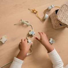 a child is playing with toys on the table