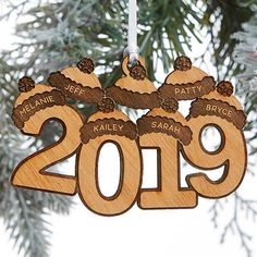 a wooden ornament hanging from a christmas tree