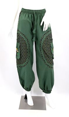 Traditional Green Embroidered Pants, Traditional Embroidered Green Pants, Baggy Embroidered Cotton Bottoms, Harem Pants With Pockets For Festivals, Baggy Green Pants For Festival, Green Baggy Pants For Festival, Traditional Green Harem Pants With Loosely Fitted Hips, Traditional Style Baggy Pants For Spring, Cotton Trousers For Festivals