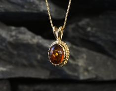 Gold Amber Pendant set with Natural Amber in the highest quality & brownish-yellow translucent resin, at 10x8mm, 3 Carats, sourced from Russia. Gold Dainty Pendant in Vintage design made of Gold Vermeil ☞ thickest 18k Gold Plating on top of Solid 925 Sterling Silver ☞ made to last. Free Gold Vermeil Chain with every Pendant order, 18 inch Silver chain (46 cm) ✓ Matching Ring & Earrings - please ask me ⌛Last Pendant left ⌛ ❀ Each Natural Gem is unique & will have Slight variations from the produc 14k Gold Oval Amber Jewelry, Classic 14k Gold Amber Jewelry, Polished 14k Gold Amber Jewelry, Oval Amber Birthstone Jewelry, 14k Gold Amber Jewelry With Polished Finish, Oval Amber Necklace For Anniversary, Formal Oval Amber Necklace, 14k Gold Oval Jewelry With Bail, Luxury 14k Gold Jewelry With Oval Bail