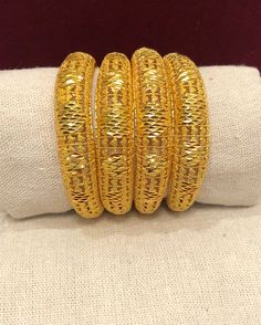 Bangles - Indian Bridal Bangles - handmade Bangles for Women Gold Bangles for Women - Indian Bridal Bangles - Handmade Bracelet These stylish bangles feature a classic bangle design and are available in gold color. Material: High quality 24k gold plated bangles ( Not solid gold) Diameter: 2.36 inches Thick Bangles Wide: 0.53 Can open Lead & Nickel free Tarnish resistant Hypoallergenic Adjustable Round Bangle With Intricate Design, Handmade Gold Bangle With Round Beads, Gold Bangle With Round Beads For Wedding, Handmade Round Bangle For Festivals, Handmade Bangle For Festivals, Gold Flexible Bangle For Wedding, Adjustable Bangle For Festive Occasions, Yellow Metal Bangle Bracelet, Adjustable Bangle For Festivals