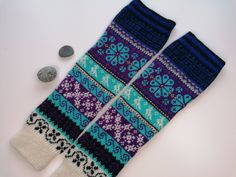 Unique Muhu pattern wool knitted leg warmers, 100% wool. Full of colour and magic. Long model size. Nice winter accessories, soft and comfortable to wear. Multicolor pattern, what is uniquely created at Muhu Island in Estonia. As many pattern, as many colors as possible. Truly eye catcher. Basic colors are: black, blue, aquamarine, purple, red, white. Traditional Estonian Muhu stocking pattern - ideas taken from knitting book: https://epood.saara.ee/pood/estonian-knitting-2-socks-and-stockings I Blue Knitting Pattern For Winter, Blue One-size Leg Warmers For Fall, Cozy Blue Leg Warmers For Winter, Cozy Knitted Multicolor Leg Warmers, Knitted Blue Leg Warmers For Winter, Cozy Multicolor Knitted Leg Warmers, Blue Knitted Leg Warmers For Winter, Fitted Winter Crochet Patterns, Fitted Crochet Patterns For Winter