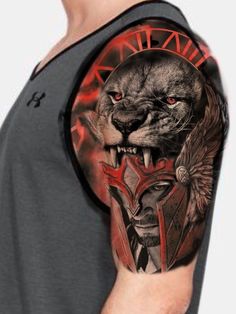 a man with a tattoo on his arm has a lion and eagle design on it