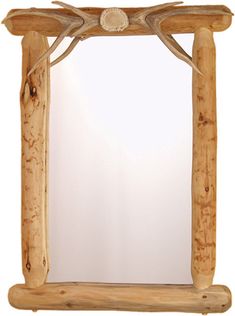 a wooden frame mirror with antlers on it