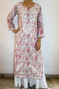 Mulmul Printed Kurta Split neck, Full sleeves, Relaxed Fit with side slits for comfort and ease. Embroidered in Chikankari. Length -  47/48 inches Sizes -  S - fits bust 34 M - fits bust 36 L - fits bust 38 XL - fits bust 40 0X - fits bust 42 1X - fits bust 44 2X - fits bust 46 3X - fits bust 48 Prewashed. Preshrunk. Bucket wash separately in cold water. Line dry. Light iron for best resul White Floral Print Kurta, White Printed Long Sleeve Tunic, White Long Sleeve Printed Kurta, White Floral Print Long Sleeve Kurta, White Long Sleeve Floral Print Kurta, White Straight Kurta Tops With Printed Motifs, White Printed Tunic Kurta, Mulmul Kurta, Womens Tunics