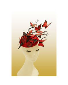 Hat Title : Lolaka (in red) A showstopper hat made with red round base, which is adorned with dark twisting branches and fluttering butterflies in different shades of red. The branches move upward to the side, carrying the eye with it and giving the impression of height and drama. The butterflies are in different shades of red which add depth to the composition.  Perfect for race days, weddings and other special events.  Adheres to your head via a millinery elastic and a comb. Note:If you wish t Red Adjustable Holiday Hat, Whimsical Red Headband Style Headpiece, Red Whimsical Headband Style Headpiece, Adjustable Red Hat For Carnival, Red Top Hat With Curved Brim For Spring, Red Hats For Spring Gifts, Red Curved Brim Top Hat For Spring, Red Spring Hat As Gift, Red Spring Hat For Gift