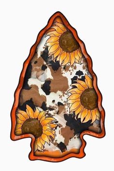 the sunflowers are painted on an orange and brown triangle shaped object with black spots