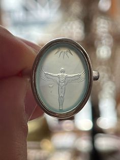 "Out of passion I'm engraving gemstones. Here I'm offering a bespoke intaglio ring with a picture of Icarus that I designed engraved onto agate in a colour of your choice. The myth of Icarus in greek mythology tells the tale of a young man seeking to fly higher and higher until he flew too close to the sun, literally. A beautiful story with a lot of symbolism. Please choose your desired metal from 925 sterling silver without or with gold plating or 14ct (585) gold or white gold. Please add the stone colour of your choice under \"personalisation\"." Oval Intaglio Symbolic Rings, Oval Symbolic Intaglio Rings, Intaglio Jewelry, Intaglio Ring, Greek Ring, Closer To The Sun, Beautiful Story, Beautiful Stories, Glass Rings