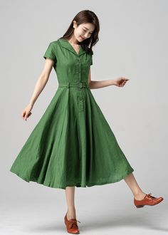 This vintage-inspired short-sleeved shirt dress is the perfect addition to any retro lover's wardrobe! Featuring a classic collared neckline, front button closure, and a flattering A-line silhouette, this dress is both timeless and trendy. The lovely shade of green is sure to turn heads and the lightweight fabric makes it perfect for warmer weather. DETAILS *  100% linen *  Two side pockets *  Front Button up closure *  Belted dress *  Short sleeve *  Notched collar *  Below knee Length *  Perfe Green Linen Dress, Custom Dress, Wool Clothing, Vestidos Vintage, Dress Short Sleeve, Green Outfit, Green Midi Dress, Midi Shirt Dress, Linen Dresses