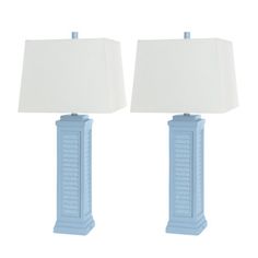 two blue lamps sitting next to each other on a white background with one lamp turned off