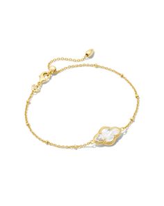 Our iconic medallion—representing joy, optimism, possibility, and femininity—gets reimagined in the Abbie Gold Satellite Chain Bracelet in Ivory Mother-of-Pearl. With its elegant and elongated stone and subtle satellite chain detailing, it’ll be the perfect addition to your bracelet stack.,Metal14k Gold Over BrassMaterialIvory Mother-Of-PearlClosureLobster claspSize8L, 0.41WDue to the one-of-a-kind nature of the medium, exact colors and patterns may vary slightly from the image shown.} | Kendra Cute Jewelry Silver, Enewton Jewelry, Bracelet Words, Gold Jewelry Bracelets, Real Gold Bracelet, Kendra Scott Bracelet, Surf Jewelry, Preppy Jewelry, Cute Bracelet