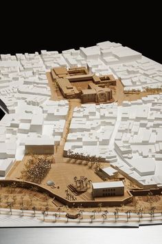 a model of a city with lots of white buildings