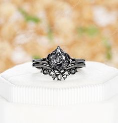 Elevate your love story with a mesmerizing 6x8mm pear-cut Black Rutilated Quartz solitaire Celtic knot engagement ring, delicately intertwined with tradition and symbolism. Paired perfectly with a black moissanite moon phase wedding band, this enchanting combination captures the essence of celestial beauty and everlasting unity. ✦Description ✦Main ring * Main stone: 1carat 6x8mm Pear Shape Black Rutilated Quartz *Band Width(Bottom): Approx. 1.6mm *Material: Silver/10k/14k/18k white gold, plated Silver Teardrop Solitaire Jewelry For Wedding, Pear Shaped Solitaire Jewelry For Wedding, Pear Shaped Bezel Setting Wedding Rings, Pear-shaped Solitaire Jewelry For Wedding, Rose Cut Pear-shaped Diamond Promise Ring, Pear-shaped Bezel Set Jewelry For Wedding, Pear-shaped Bezel Set Wedding Ring, Pear-shaped Rose Cut Diamond Promise Jewelry, Gothic Black Crystal Promise Ring