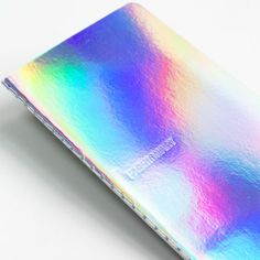 a colorful card case sitting on top of a white table