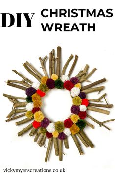 a christmas wreath made out of sticks with pom - poms on it and the words diy christmas wreath