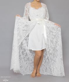 Floor length bridal lace robe with Chantilly French lace Length: 160 cm / 62 in Loose-fitting Bell sleeves Silky ribbon belt Scalloped neckline, lace cuffs and hemline Model is 160 cm/ 5'3'' and wearing a size S Scalloped Neckline, Bridal Robe, Lace Cuffs, Dream Dresses, Ultra Feminine, Ribbon Belt, Bridal Robes, French Lace, Bridal Lace