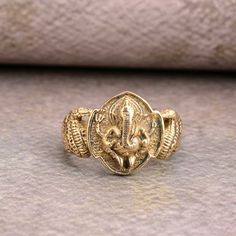 Antique Gold Ganesha Finger Ring , Party Wear Rings , Temple Jewelry , Finger Rings , Spiritual Jewelry ❥ Customers satisfaction is our biggest priority, please contact us with any questions/queries for future or existing orders, and we will do our best to make sure you are happy with your order. ❥Please make sure to add the correct address during check out. You can return your purchased item within 15 days after successful delivery. We offer a 100% "Money Back Guarantee" if you are not satisfied with your purchase. Return charges will be paid by buyers only! ❥ Please share your numbers (in personalization box ) as required for shipping address details, and it'll help us to contact you easily. And don't worry about the privacy, we'll keep it safe with us, So try to cooperate with us. :) Yo Diwali Gift Toe Ring Jewelry, Spiritual Toe Ring Jewelry For Festivals, Temple Jewelry Rings For Festivals And Puja, Temple Jewelry Rings For Puja And Festivals, Symbolic Festive Jewelry For Festivals, Gold Rings As Diwali Gifts, Gold Rings For Diwali Gift, Gold Rings For Puja And Festivals, Temple Jewelry Style Rings As Diwali Gift