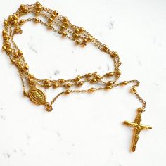 This 10K Yellow Gold Vintage Rosary Necklace is a classic and timeless piece. Crafted in 10K yellow gold and featuring 2.5mm beads, this 32" necklace is sure to bring sophistication and sophistication to any ensemble. A piece you'll love to keep for years to come. Thank you for visiting our shop!Visit our website DmKJewelry.comAlso Follow us on Instagram https://www.instagram.com/dmkjewelryny/ 32 Necklace, Vintage Rosary, Rosary Necklace, Rosary, Timeless Pieces, Yellow Gold, Thank You, Beads, Yellow