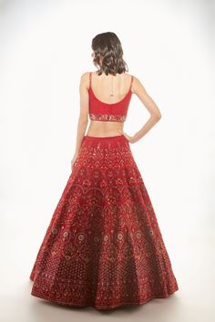 A red raw silk skirt with resham, sequins, and mirror embroidery paired with a quilted bralette and net dupatta From Chamee and Palak 's The Wedding Edit collectionDELIVERY TIMEPlease allow 8-12 weeks for your outfit to arrive.FABRIC DETAILSRaw silk and NetProfessional cleaning only. Party Wear Raw Silk Choli With Intricate Embroidery, Party Wear Embroidered Lehenga In Raw Silk, Navratri Party Gown With Intricate Embroidery, Red Party Wear Set With Dupatta, Party Wear Embroidered Gown For Navratri, Embroidered Party Wear Gown For Navratri, Embroidered Party Gown For Navratri, Embroidered Party Wear Choli For Reception, Festive Party Wear Embroidered Fabric For Reception