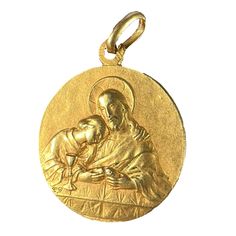 A French 18 karat (18K) yellow gold charm pendant designed as a medal depicting Jesus preparing the holy communion at the Last Supper to one side. The reverse with a frame of the holy dove representing the holy spirit above a sheaf of wheat to the left, representing the communion wafer of holy bread, to the right a grape vine to represent the communion wine. To the base the lamb of God with a cross. The centre engraved with the monogram MC / CM and the date 18 Juin 1908. Stamped with the eagle's head for 18 karat gold and French manufacture.  Dimensions: 2.4 x 2 x 0.15 cm (not including jump ring) Weight: 4.12 grams (Chain not included) Yellow Gold Medallion For Commemoration, Yellow Gold Coin Pendant For Commemoration, Spiritual Yellow Gold Jewelry And Charms For First Communion, Spiritual Yellow Gold Jewelry For First Communion, Holy Bread, Communion Wine, Sheaf Of Wheat, The Lamb Of God, Jesus Christus