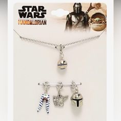 the star wars necklace has three charms on it