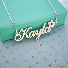 Order any word or name, for your new Solid Sterling Silver 925 Kayla Flower Birthstone Name Necklace! * Nameplate and chain are all solid sterling silver 925. Hallmarked 925 for authenticity.  * Nameplate upgraded thickness is 1.2mm. * 11mm tall first capital letter. This is my standard size nameplate necklace.  * Choose any birthstone you would like to have placed on your special flower accent.  * Choose your chain length and style from the menu above. * Please add the name that you would like Sterling Silver Nameplate Necklace For Birthday, Sterling Silver Nameplate Necklace For Birthday Gift, Sterling Silver Flower Pendant Necklace For Birthday, Sterling Silver Name Necklace With Birthstone For Personalized Gift, Sterling Silver Birthstone Name Necklace For Birthday, Sterling Silver Pendant Name Necklace For Birthday, Sterling Silver Name Jewelry For Birthday Gift, Personalized Silver Name Necklace Hallmarked, Silver Hallmarked Name Necklace For Anniversary