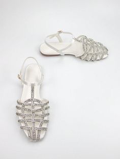 Elevate your style with our Gorgeous Rhinestone Sandals. Made with light brown sardine fabric and featuring a braided ankle strap, these flats are perfect for both daily wear and parties. The sparkling rhinestones add a touch of glam to any outfit. Order now for a stunning look. Color : Brown Toe : Open Toe Details : Buckle Upper Material : Satin Lining Material : PU Leather Insole Material : PU Leather Outsole Material : TPR Size US Ball Girth Foot Length Heel Height EUR35 US5 20.5 22.06 1.1 EU Strap Flats, Ankle Strap Flats, Rhinestone Sandals, Comfortable Sandals, Wearing Black, Shoe Collection, Light Brown, Party Wear, Ankle Strap