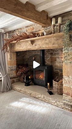 a living room with a fire place next to a window and curtains on the windowsill