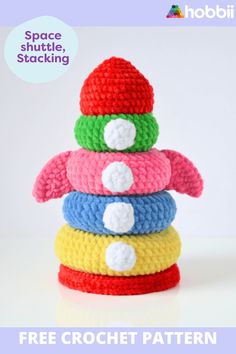 a stack of crochet toys with the text space shuttle stacking on top