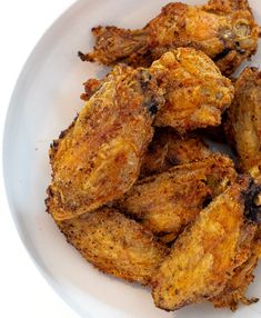 fried chicken pieces on a white plate