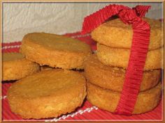 a pile of cookies sitting on top of a red table cloth