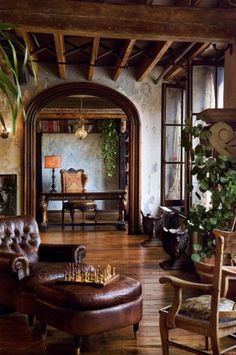 a living room filled with furniture and a large mirror