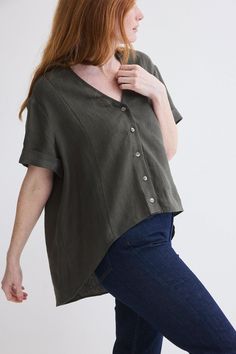 This top is a spring/summer staple exuding effortless charm and versatility with its breathable fabric and casual button-up design. High low silhouette V-neck with button down closure Short sleeves Oversized fit Summer Staples, Linen Top, Oversized Fits, Breathable Fabric, High & Low, High Low, Fashion Forward, Button Up, Spring Summer