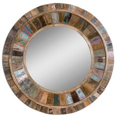 a round mirror made out of wood and metal with multicolored tiles on it