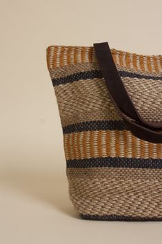 Brand: Lovestitch The Jute Tote is the perfect accessory for a stroll through the market, or a day at the beach. Large enough to carry groceries, beach essentials, or pack for a weekend getaway. Crafted from jute material, it features multiple interior pockets, a magnetic snap closure, and leather/canvas straps for a durable and stylish finish. ♡ Details Color: Natural/Mustard Lined inside Zipper pocket | 2 additional inside open pockets Magnetic snap closure Partial suede leather contrast handl Sand-colored Woven Jute Bags, Vacation Beach Bag With Adjustable Strap, Jute, Eco-friendly Jute Shoulder Bag With Adjustable Strap, Eco-friendly Jute Beach Bag With Top Handle, Eco-friendly Multicolor Jute Shoulder Bag, Jute Tote Bag, Jute Totes, Jute Tote Bags, Beach Essentials