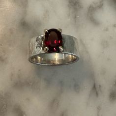 Size 6.5. Minimal Wear. Colorful And Bold, An Oval Faceted Garnet Set In 14k Gold Complements A Reflective Sterling Silver Hammered Band. Will Consider Reasonable Offers. Questions? Leave A Comment Below Modern Silver Ruby Ring For Formal Occasions, Modern Sterling Silver Ruby Ring For Anniversary, Modern Silver Ruby Ring With Polished Finish, Modern Silver Ruby Ring With Oval Shape, Modern Silver Ruby Rings, Modern Silver Rings With Ruby, James Avery Jewelry, Chunky Ring, Hammered Band