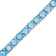 Celebrate her December birthday with this stunning tennis bracelet. Fashioned in sleek sterling silver, this eye-catching tennis bracelet is lined with glistening 5.0mm prong-set regal blue topaz - a colorful take on tradition. Polished to a brilliant shine, this 7.5-inch bracelet secures with a lobster claw clasp. Topaz Jewelry November, Irish Ring, Egyptian Bracelet, Topaz Bracelet, Mommy Jewelry, Blue Topaz Bracelet, Trending Bracelets, Topaz Jewelry, Stylish Bracelet