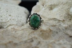 This is the perfect option for those who like cool, unique jewelry and the luxury, shine of sterling silver, green . This ring is well made, cute and/or elegant in design, and very desirable. The size of the ring is 5.5. This ring is decorated with green stone in the sterling bezel on the top. The top has shape of oval. The oval is about 3/4'' by 2/4''. ♥ Age/era: Circa 1930s - 1980s. ♥ There is no hallmark, but it is 925, sterling silver, tested with acid. Every one interested in the jewelry sh Green Turquoise Ring As A Gift, Classic Green Turquoise Ring For Gifts, Green Turquoise Ring For A Gift, Green Turquoise Ring For Gift, Green Oval Dainty Rings, Dainty Green Oval Ring, Elegant Green Turquoise Ring Stamped 925, Classic Oval Turquoise Ring, Classic Oval Emerald Ring Stamped 925