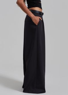 Color: Black Lightweight fluid fabric Relaxed fit Wide leg Pleated detailing Side seam pockets Illusion welt back pocket Hook and bar closure Zip fly Unlined 75% Polyester 25% Rayon Dry Clean By The Frankie Shop. Imported Chic Black Wide Leg Pants With Pressed Crease, Tailored Black Pants With Side Pockets, Formal Black Pants With Side Pockets, Classic Wide Leg Bottoms With Hidden Pockets, Chic Black Semi-formal Pants, Tailored Semi-formal Bottoms With Side Pockets, Semi-formal Tailored Bottoms With Side Pockets, Semi-formal Wide-leg Pants With Pockets, Classic Wide-leg Pants With Side Pockets