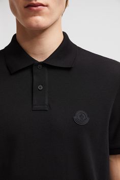 A timeless design that transcends seasons, this polo shirt is crafted from cotton piqué. The classic style is embellished with a Moncler logo patch on the chest. Designer Top With Embroidered Logo And Collared Neckline, Designer Tops With Embroidered Logo, Classic Top With Collared Neckline And Embroidered Logo, Luxury Polo Shirt With Ribbed Collar And Short Sleeves, Luxury Polo Shirt With Ribbed Collar For Work, Classic Top With Embroidered Logo And Collared Neckline, Luxury Polo Shirt With Ribbed Collar, Luxury Short Sleeve Polo Shirt With Ribbed Collar, Luxury Cotton Polo Shirt For Workwear