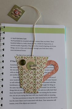 the book is open to show an image of a coffee cup with a question mark on it