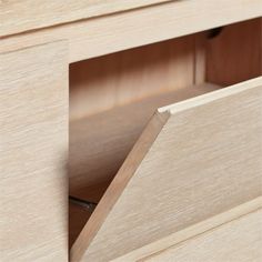 an open drawer in a wooden cabinet